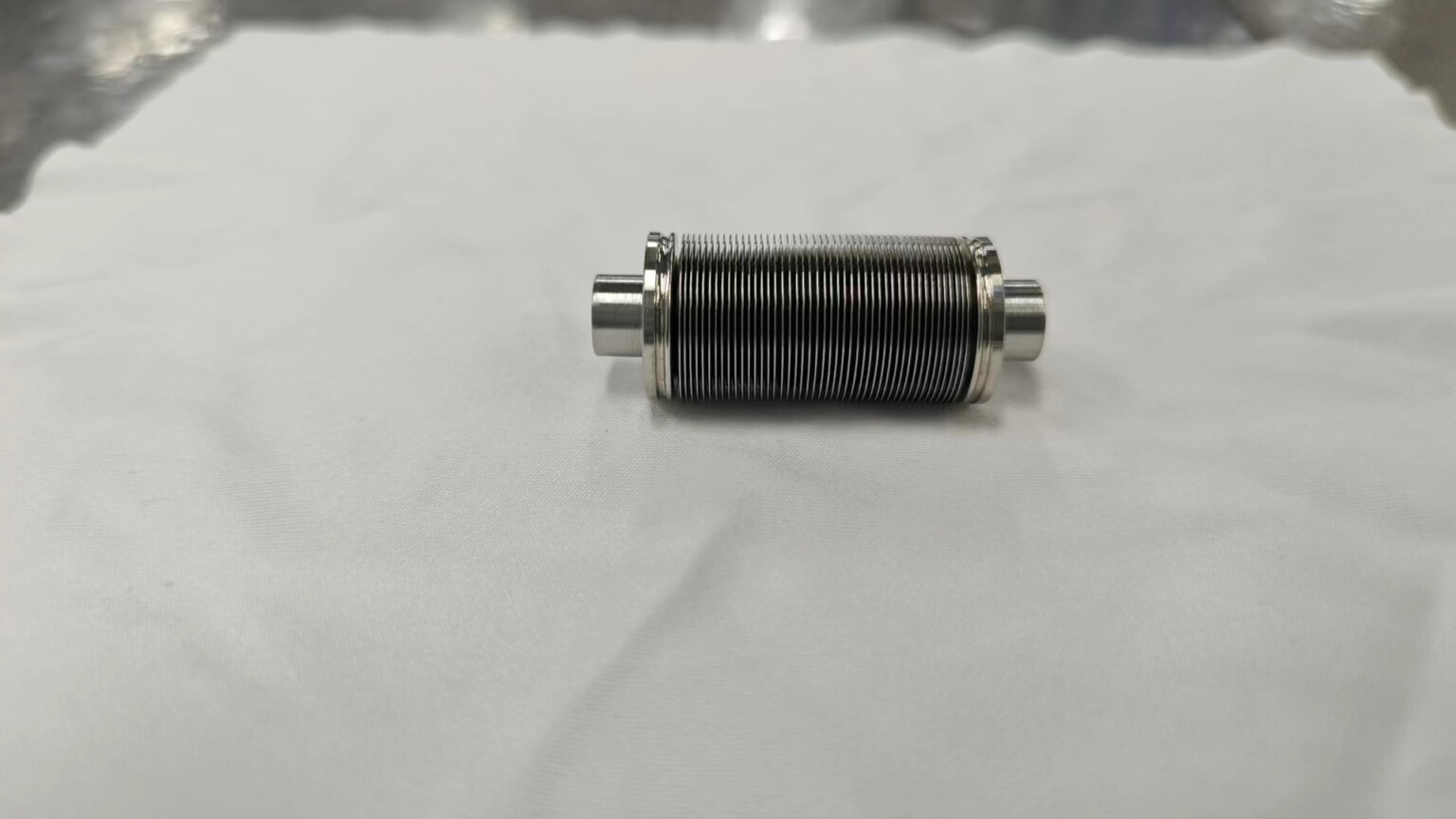 Edge welded bellows helium leak testing